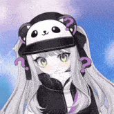 a girl wearing a panda hat with a question mark around her neck