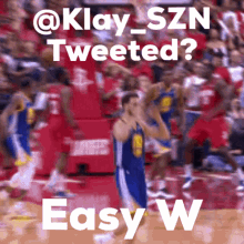 a blurred image of a basketball game with the words " tweeted easy w "