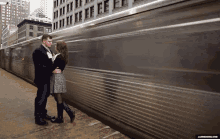 couple train station train love caught in the moment