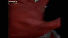 a close up of a cartoon character with glowing eyes and the word ultraman on the bottom