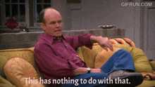a man sits on a couch with the words " this has nothing to do with that "