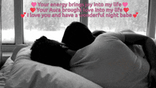 a black and white photo of a man and woman laying in bed