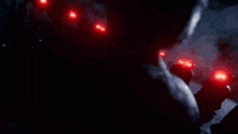 a row of red lights on a dark background