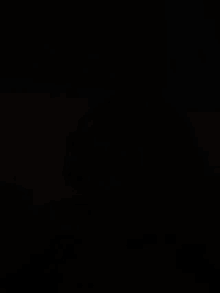a person wearing a watch in the dark