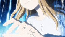 a girl with blonde hair is wearing a white shirt with chinese writing on the front