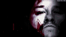 a poster for kevin owens with a man 's face in the background