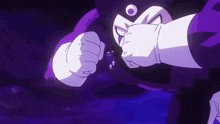 a close up of a person 's fist being punched by another person .