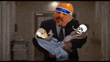 a man in a suit is holding a baby with skulls around it