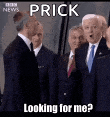 a group of men in suits and ties are standing next to each other and one of them says prick looking for me