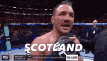 a man in a boxing ring with scotland written on the bottom