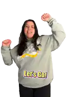 a woman wearing a sweatshirt that says let 's go on it