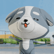 a gray and white stuffed animal with its eyes closed and its tongue out