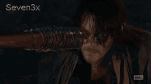 a close up of a man 's face with the words seven3x on the bottom right
