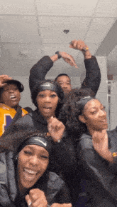 a group of people wearing nike headbands are posing for a picture together