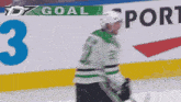 a hockey player with the number 3 on the wall