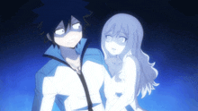 a man and a woman are standing next to each other in a blue background