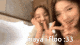 maya i floo 3:33 is written on a picture of two women