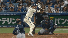 a baseball player with the number 45 on his jersey is at bat