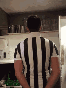 a man in a black and white striped shirt