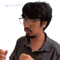 a man with glasses and a beard has the number 2 in the corner