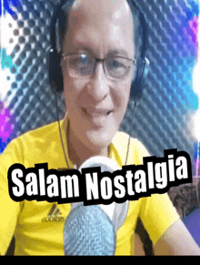 a man wearing headphones and a yellow shirt with the words salam nostalgia