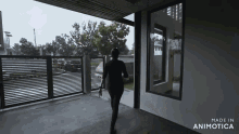 a woman is walking into a house that was made in animotica
