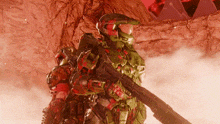 a man in a military uniform is holding a shotgun