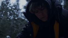 a person wearing a jacket that says ' the north face ' on it
