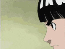 a close up of a cartoon character 's face with black hair and white ears .
