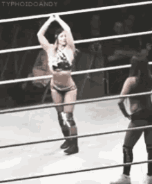 two women in a wrestling ring with typhoidcandy written on the bottom