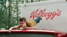 Holding On A Roof Of A Moving Truck Bobby Cabana GIF - Holding On A Roof Of A Moving Truck Bobby Cabana Unfrosted Movie GIFs