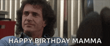 a man in a blue shirt is smiling and says happy birthday mamma