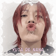 yuta de nana is written on a picture of a man with red hair