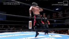 a man in a wrestling ring with the number 127 on the bottom right