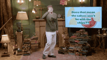 a man is dancing in front of a screen that says does that mean the salsas won t be with the chips