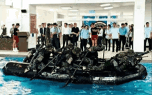 a group of soldiers in a raft in a pool