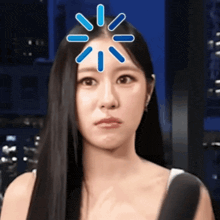 a woman with long black hair has a light coming out of her forehead