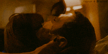 a close up of a man and woman kissing with haynah @ discord written on the bottom