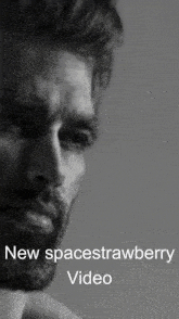 a man with a beard is shown in a black and white photo with the caption " new spacestrawberry video "