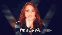 a woman blowing a kiss with the words i 'm a diva behind her