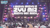 a crowd of people watching a mizyu mizyu zyu miz mizyu go mizyu concert