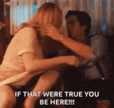 a man and a woman are kissing in a room and the woman is holding the man 's arm .