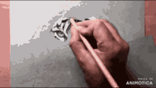 a person is drawing a tiger with a pencil on a piece of paper made in animatica