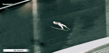 a ski jumper is flying through the air with a 90.3 km / h speed