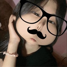 a girl with glasses and a fake mustache