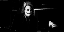a black and white photo of the joker from the dark knight .