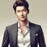 a man in a suit and white shirt is smiling .