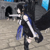 a girl with wings is standing in front of a building with candles