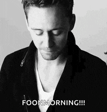 a black and white photo of a man with his eyes closed and the words `` foonmorning '' written below him .