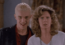 a man and a woman are standing next to each other and the woman is saying you 're a very bad man